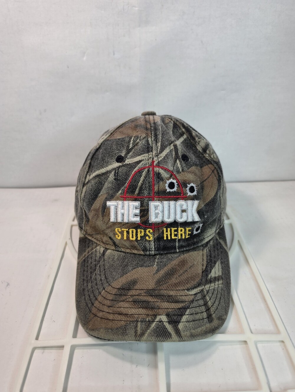 "The Buck Stops Here" Embroidered Camo Hunters Ball Cap. Strap-Back (Womens)